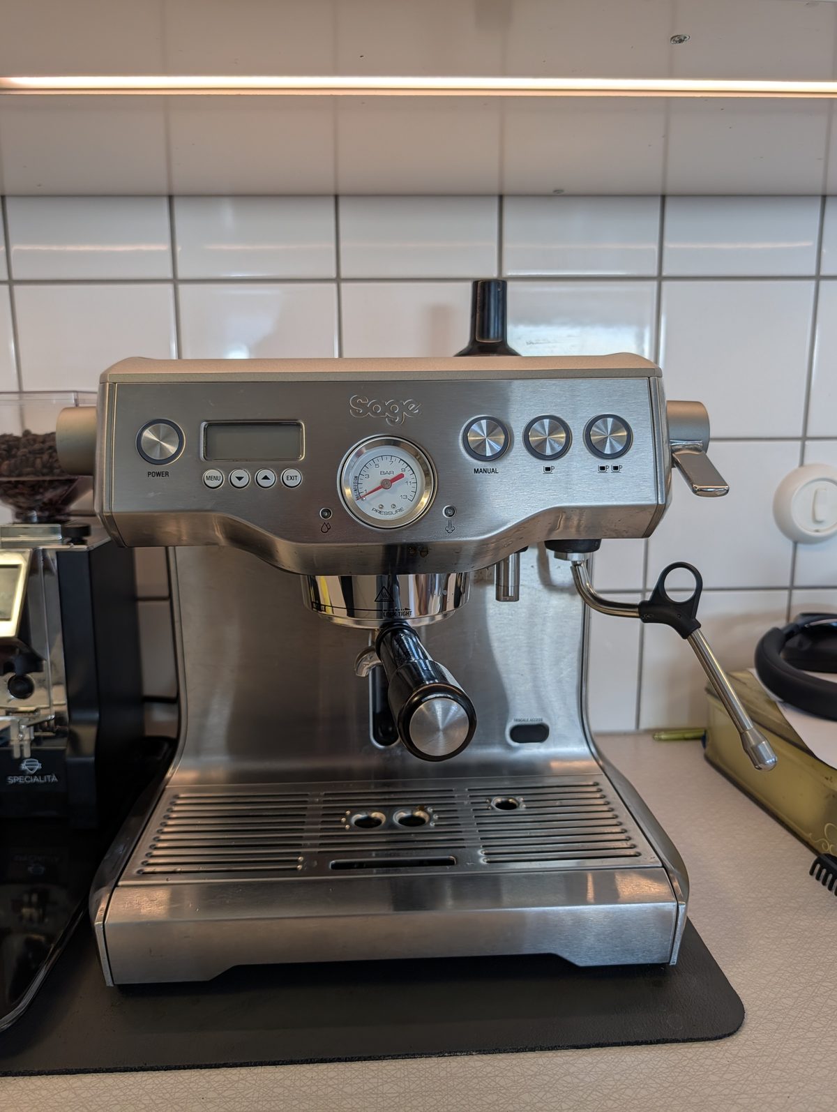 Sage Dual Boiler BES920 espresso machine in steel with portafilter, on kitchen counter